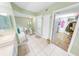 Bathroom with walk-in shower, bathtub, and double vanity at 4670 Links Village Dr # C402, Ponce Inlet, FL 32127