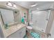Guest bathroom with walk-in shower and single vanity at 4670 Links Village Dr # C402, Ponce Inlet, FL 32127