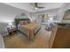 King bedroom with dark gray walls and a ceiling fan at 4670 Links Village Dr # C402, Ponce Inlet, FL 32127