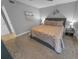 King size bedroom with gray walls and ceiling fan at 4670 Links Village Dr # C402, Ponce Inlet, FL 32127
