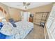 Guest bedroom with queen bed and view from window at 4670 Links Village Dr # C402, Ponce Inlet, FL 32127