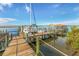 Wooden boat dock with catamaran and gazebo at 4670 Links Village Dr # C402, Ponce Inlet, FL 32127