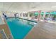 Inviting indoor swimming pool with ample seating at 4670 Links Village Dr # C402, Ponce Inlet, FL 32127