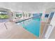Indoor heated pool with seating area at 4670 Links Village Dr # C402, Ponce Inlet, FL 32127