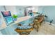 Beach-themed kitchen with breakfast bar, stainless steel appliances, and white cabinets at 4670 Links Village Dr # C402, Ponce Inlet, FL 32127