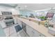 Bright kitchen featuring stainless steel appliances and white cabinetry at 4670 Links Village Dr # C402, Ponce Inlet, FL 32127