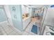 White kitchen with stainless steel appliances and a coffee bar area at 4670 Links Village Dr # C402, Ponce Inlet, FL 32127