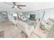 Living room with comfortable seating, large windows, and an open floor plan at 4670 Links Village Dr # C402, Ponce Inlet, FL 32127