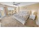 Spacious main bedroom with king-size bed and access to balcony at 4670 Links Village Dr # C402, Ponce Inlet, FL 32127