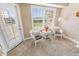 Relaxing sitting area with wicker chairs and view from large window at 4670 Links Village Dr # C402, Ponce Inlet, FL 32127