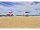 Relaxing beach scene with colorful umbrellas at 5300 S Atlantic Ave # 13307, New Smyrna Beach, FL 32169