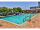 Refreshing community pool with a waterfall feature and ample lounge space at 5300 S Atlantic Ave # 13307, New Smyrna Beach, FL 32169