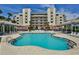 Relaxing kidney-shaped swimming pool with plenty of room for swimming and lounging at 5300 S Atlantic Ave # 13307, New Smyrna Beach, FL 32169