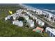 Aerial view of the complex with buildings, pools, and surrounding greenery at 5300 S Atlantic Ave # 9-304, New Smyrna Beach, FL 32169