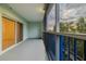 Screened balcony overlooking lush tropical landscape at 5300 S Atlantic Ave # 9-304, New Smyrna Beach, FL 32169
