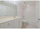 Bathroom with white vanity, toilet, and shower/tub combo at 5300 S Atlantic Ave # 9-304, New Smyrna Beach, FL 32169