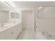 Clean bathroom, double vanity, shower, and bathtub at 5300 S Atlantic Ave # 9-304, New Smyrna Beach, FL 32169