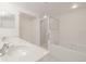 Clean bathroom, double vanity, shower, and bathtub at 5300 S Atlantic Ave # 9-304, New Smyrna Beach, FL 32169