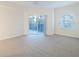 Bright bedroom with sliding glass door leading to a private balcony at 5300 S Atlantic Ave # 9-304, New Smyrna Beach, FL 32169