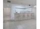 Bright kitchen with white cabinets, breakfast bar, and tile flooring at 5300 S Atlantic Ave # 9-304, New Smyrna Beach, FL 32169