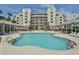 Community pool with plenty of lounge chairs for residents at 5300 S Atlantic Ave # 9-304, New Smyrna Beach, FL 32169