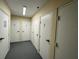 Storage hallway with several numbered storage unit doors at 5300 S Atlantic Ave # 9-304, New Smyrna Beach, FL 32169