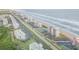 Aerial view of beachfront properties, road, and ocean at 5499 S Atlantic Ave # 905, New Smyrna Beach, FL 32169