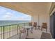 Balcony with seating area overlooking the ocean at 5499 S Atlantic Ave # 905, New Smyrna Beach, FL 32169