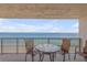 Balcony with seating and panoramic ocean views at 5499 S Atlantic Ave # 905, New Smyrna Beach, FL 32169