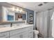 Bathroom with white vanity, marble countertop, and nautical-themed decor at 5499 S Atlantic Ave # 905, New Smyrna Beach, FL 32169