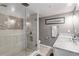 Updated bathroom featuring a walk-in shower with tiled walls and glass door at 5499 S Atlantic Ave # 905, New Smyrna Beach, FL 32169