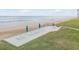 Beachfront patio with lounge chairs and ocean view at 5499 S Atlantic Ave # 905, New Smyrna Beach, FL 32169