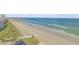 Scenic beach view with sandy shores and ocean waves at 5499 S Atlantic Ave # 905, New Smyrna Beach, FL 32169