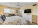Bright guest bedroom with two beds, starfish-themed bedding, and coastal decor at 5499 S Atlantic Ave # 905, New Smyrna Beach, FL 32169