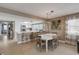 Dining area with white table and ocean views next to the kitchen at 5499 S Atlantic Ave # 905, New Smyrna Beach, FL 32169