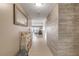 Inviting hallway with wood-look tile and coastal decor at 5499 S Atlantic Ave # 905, New Smyrna Beach, FL 32169