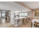Bright white kitchen with quartz countertops and breakfast bar at 5499 S Atlantic Ave # 905, New Smyrna Beach, FL 32169