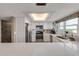 Bright white kitchen with stainless appliances and quartz countertops at 5499 S Atlantic Ave # 905, New Smyrna Beach, FL 32169