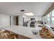 Modern white kitchen with stainless steel appliances and quartz countertops at 5499 S Atlantic Ave # 905, New Smyrna Beach, FL 32169