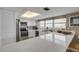 White kitchen with quartz countertops, stainless steel appliances, and ocean view at 5499 S Atlantic Ave # 905, New Smyrna Beach, FL 32169
