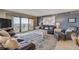 Open living room with leather couches, area rug, and coffee table at 5499 S Atlantic Ave # 905, New Smyrna Beach, FL 32169