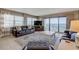 Living room with leather furniture, ocean views, and balcony access at 5499 S Atlantic Ave # 905, New Smyrna Beach, FL 32169