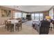 Combined living and dining area with ocean views and balcony access at 5499 S Atlantic Ave # 905, New Smyrna Beach, FL 32169
