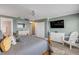 Inviting main bedroom with a king-size bed, ocean views, and a ceiling fan at 5499 S Atlantic Ave # 905, New Smyrna Beach, FL 32169