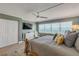 Spacious main bedroom with a king-size bed, ocean views, and a ceiling fan at 5499 S Atlantic Ave # 905, New Smyrna Beach, FL 32169