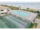 Community pool with shuffleboard courts and ocean view at 5499 S Atlantic Ave # 905, New Smyrna Beach, FL 32169