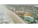 Aerial showcasing beachfront property and neighborhood at 701 N Atlantic Ave # 203, New Smyrna Beach, FL 32169