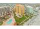 Aerial of coastal community, pools, and ocean at 701 N Atlantic Ave # 203, New Smyrna Beach, FL 32169