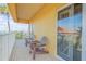 Tranquil balcony with two dark brown chairs at 701 N Atlantic Ave # 203, New Smyrna Beach, FL 32169