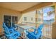 Ocean view balcony with table and chairs at 701 N Atlantic Ave # 203, New Smyrna Beach, FL 32169